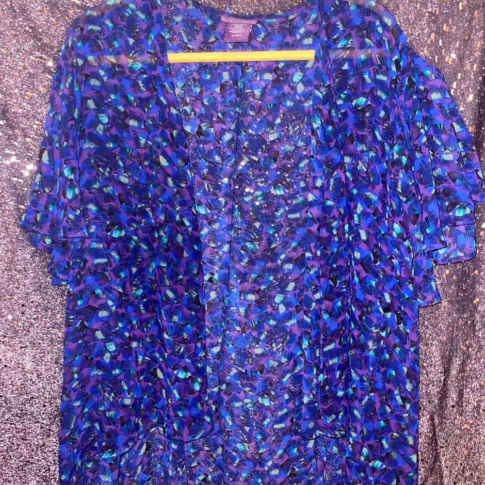 This is a a Purple,Blue,Green and Black Kimono. It is also sheer fabric.